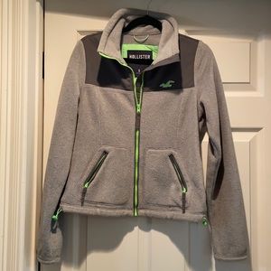 Grey Hollister jacket with neon green details